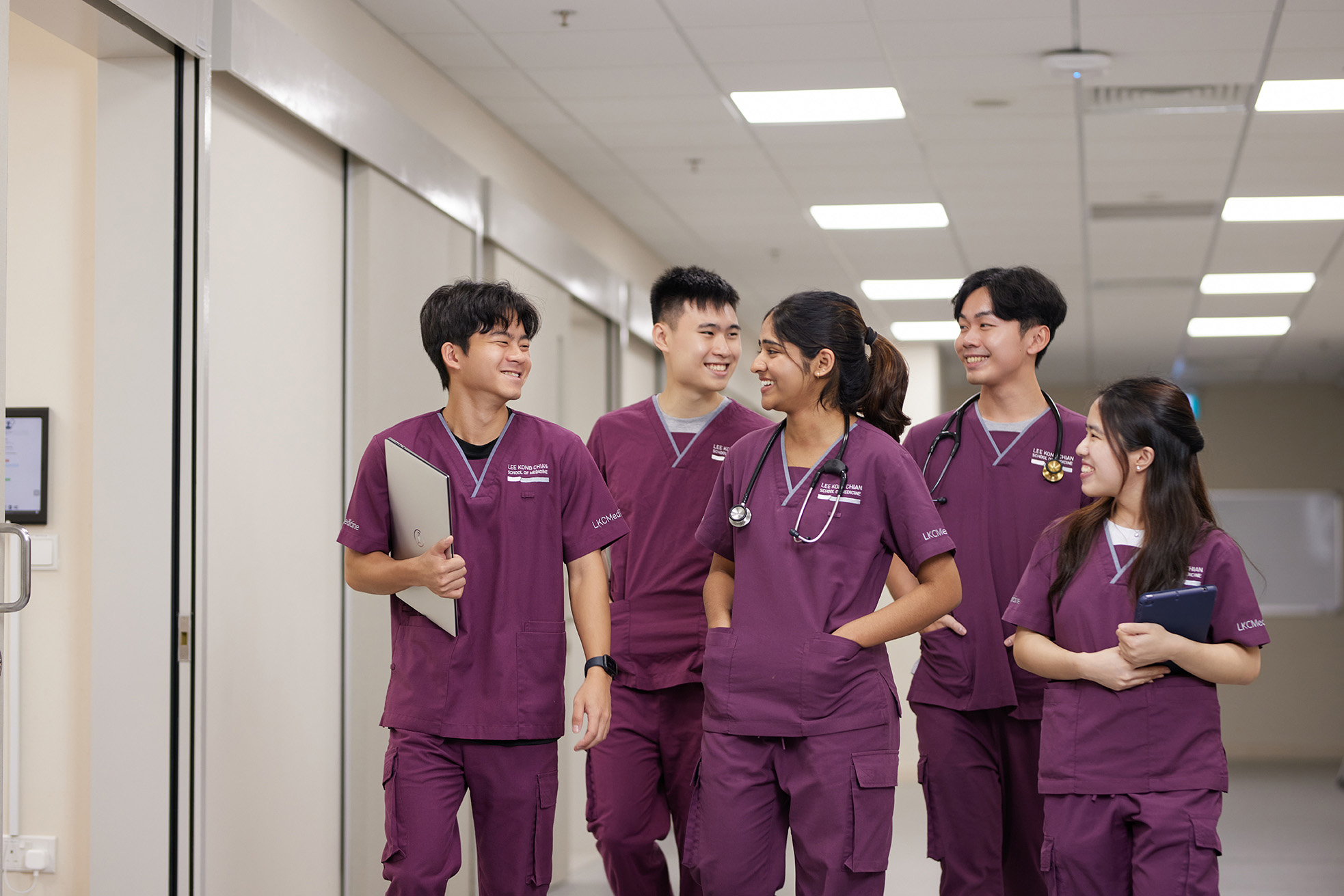 LKCMedicine students walking in hospital environment