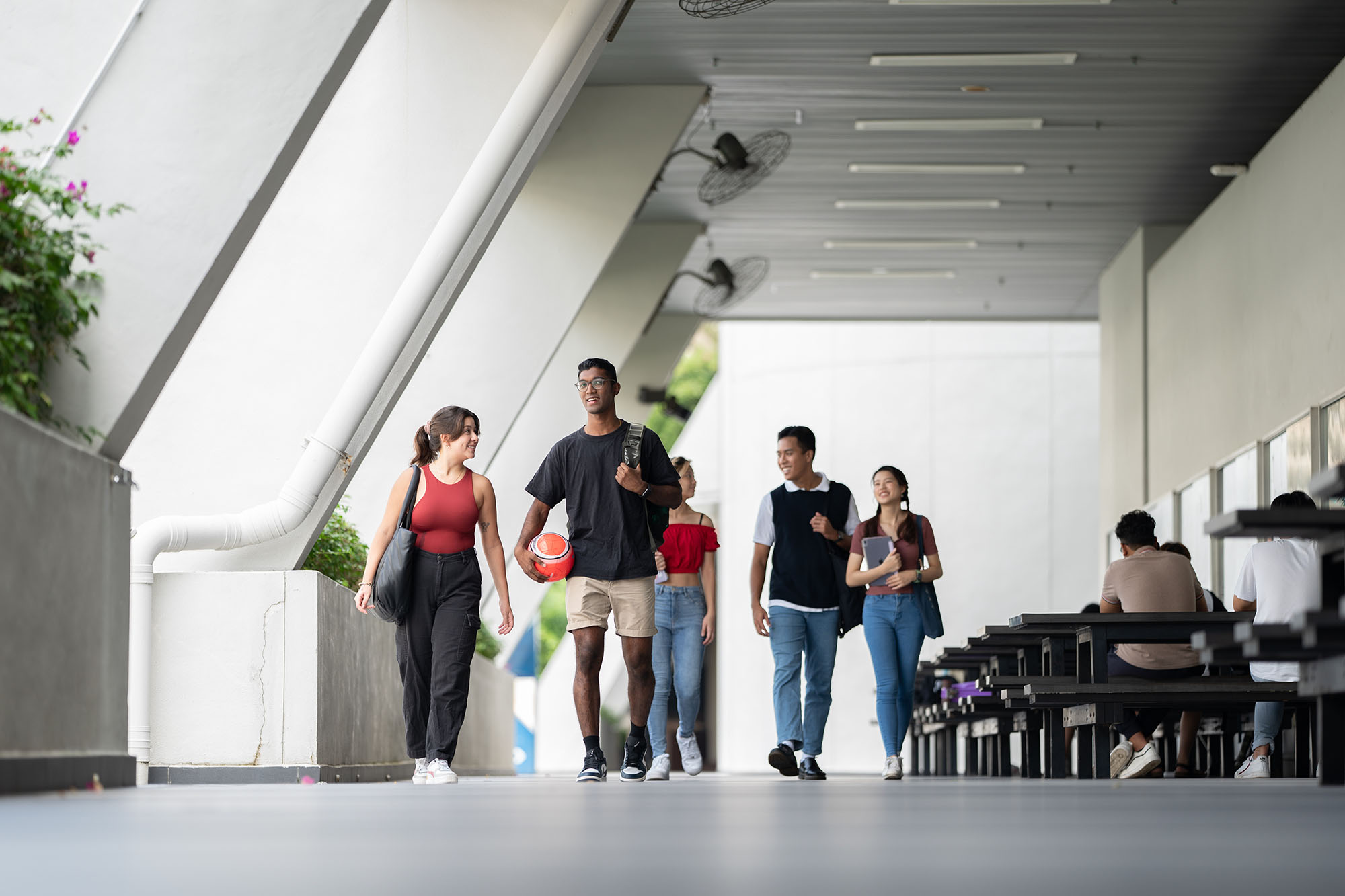 Students walking along corridor in campus