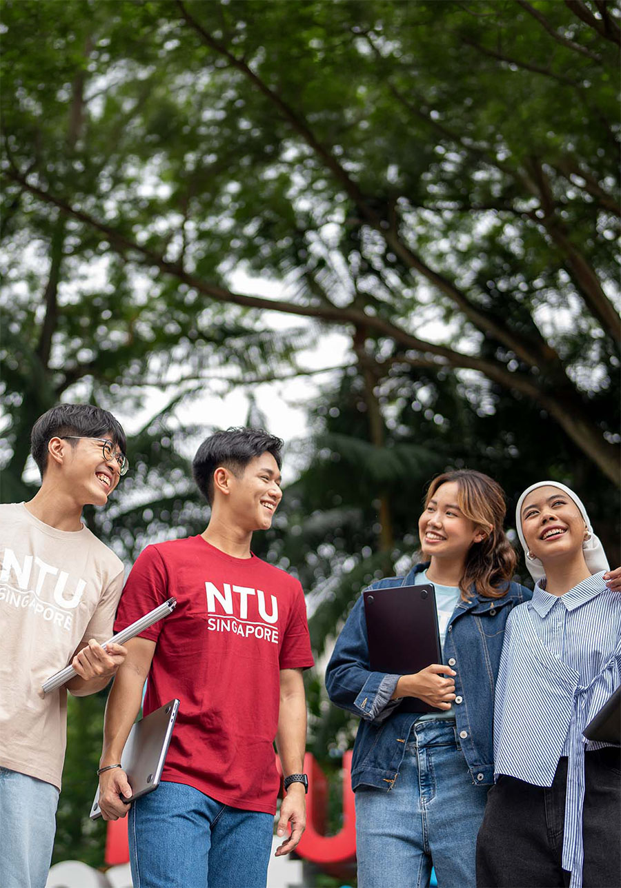 Four NTU undergraduates walking together on the NTU campus