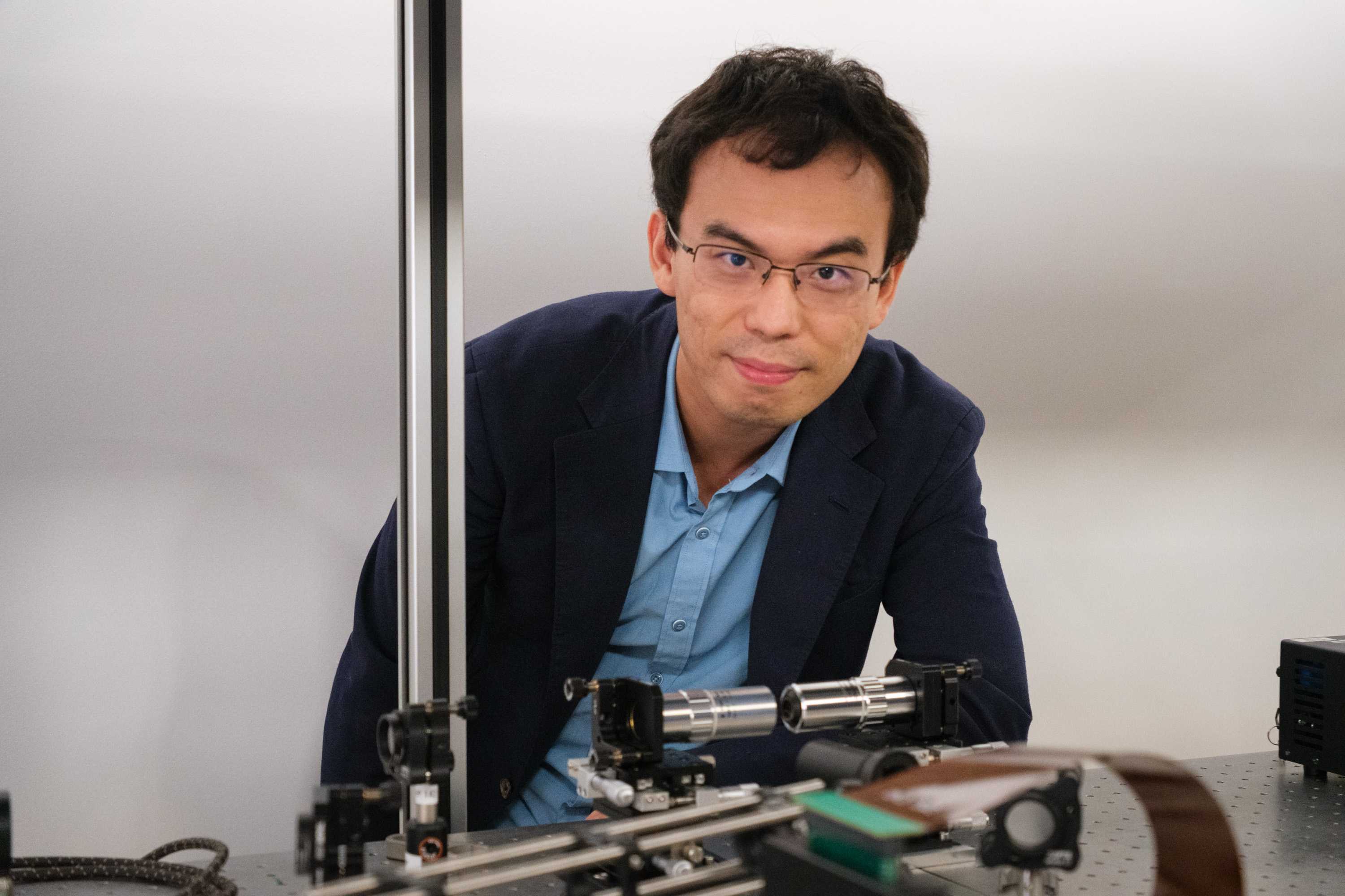 NAP Shen Yijie with the equipment used to make optical skyrmions