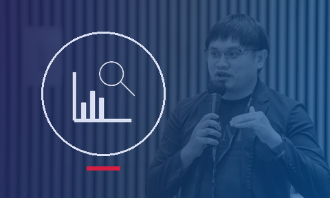 Learning analytics icon, over a photo of Dr Joel Lai presenting at AI for Education 2025