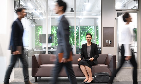 Students in business wear and one in focus