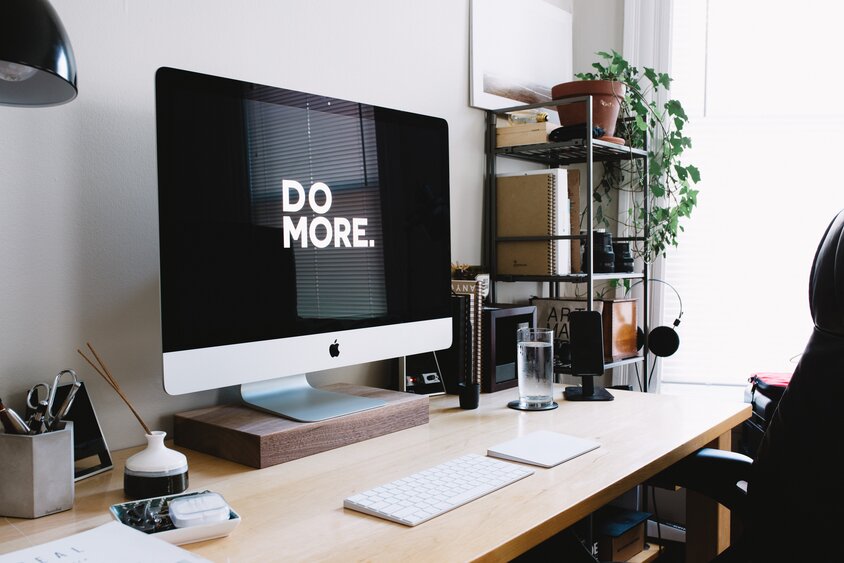 Desk with computer monitor and keyboard