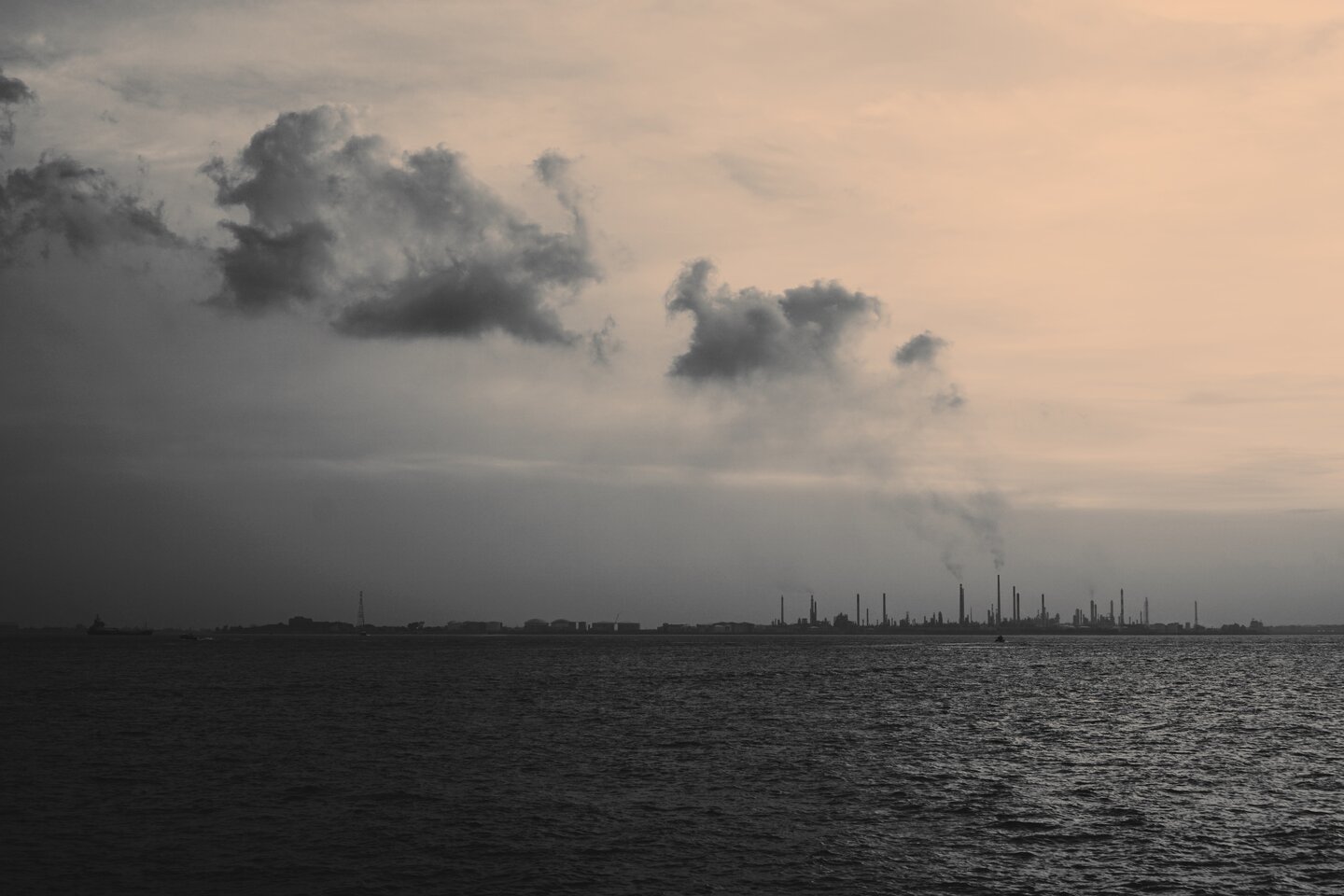 Pollution fumes from factories on the horizon