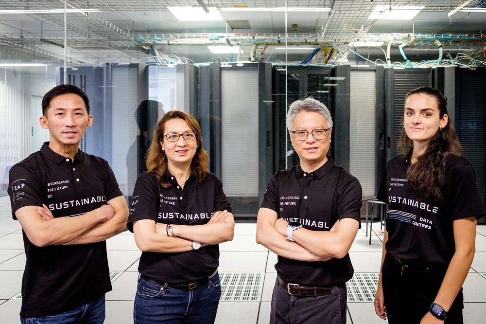 (From left) Mr Calvin Sun, Head of Business Development, RDA; Joycelyn Longue, Head of Strategic Marketing & Sales, RDA; Prof Wen Yonggang, Associate Dean (Research), NTU College of Engineering and co-founder of RDA; and Ms Angelina Terlaki, NTU Research Engineer; at NTU’s High Performance Computing Centre.