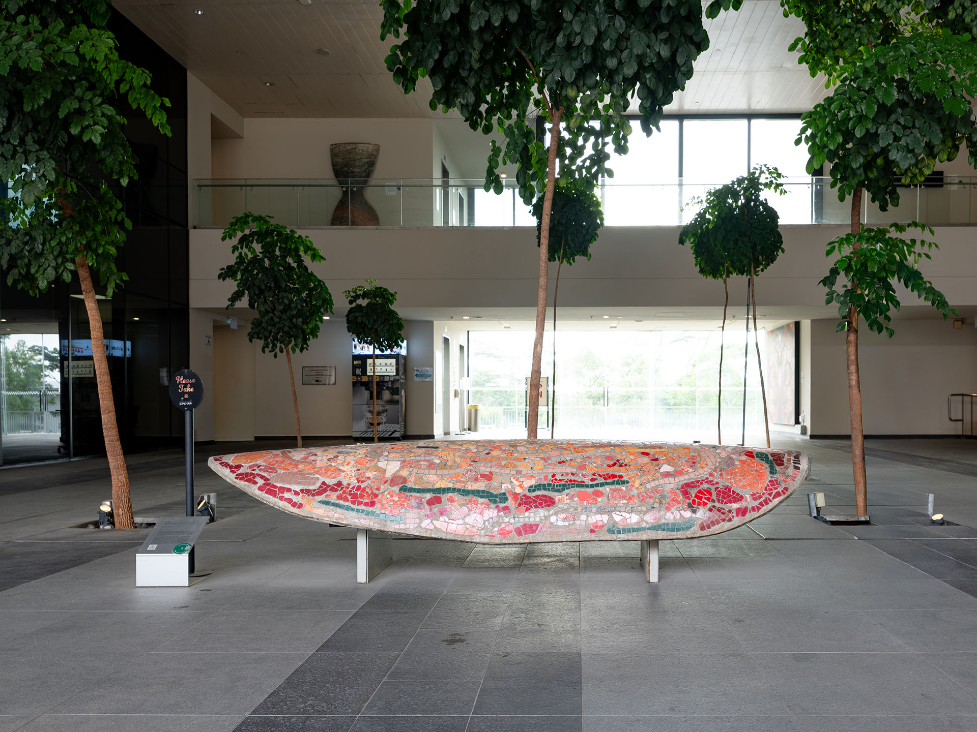 Red mosaic stone bench in an atrium