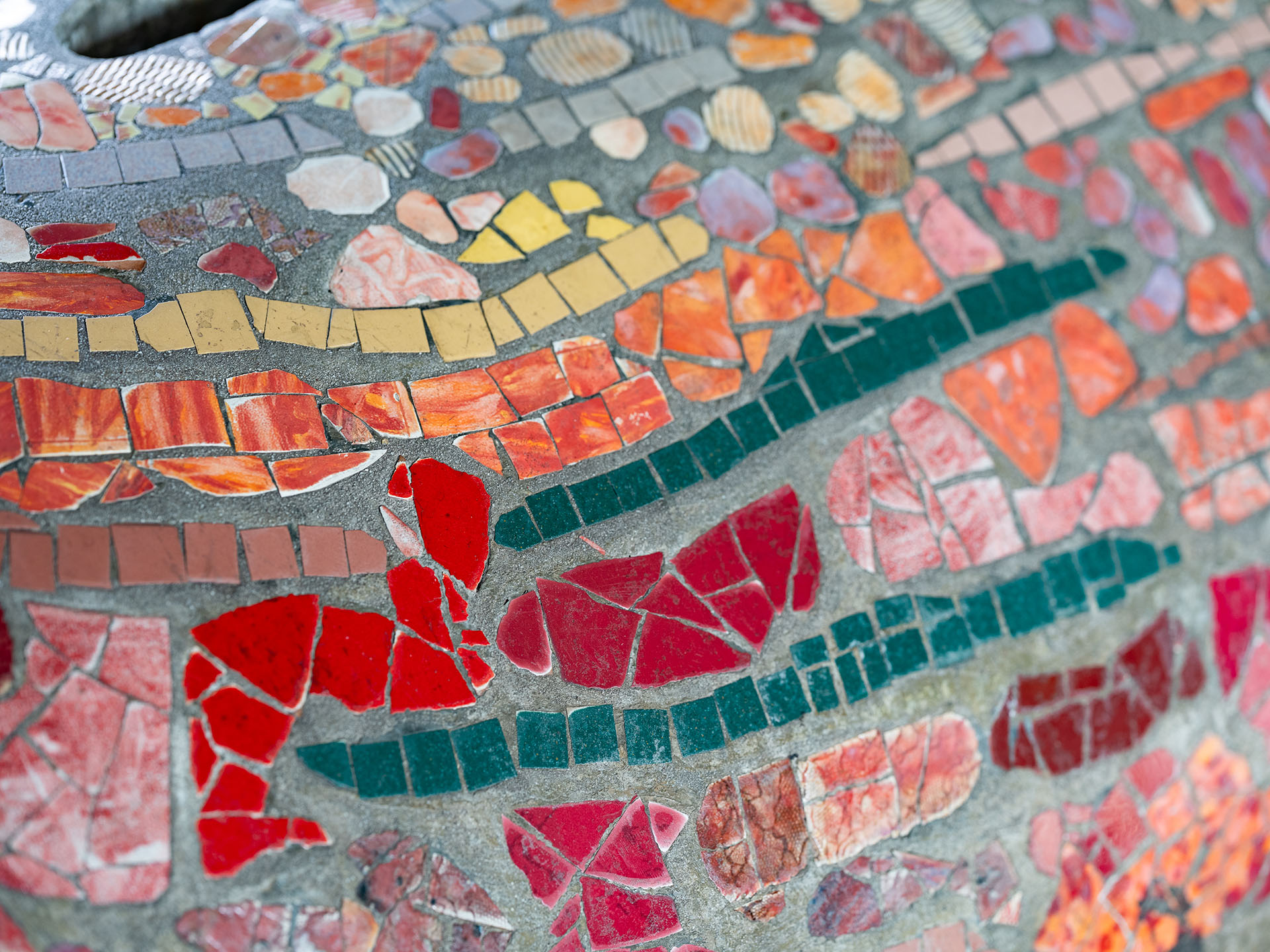 Close up of colourful mosaic pieces in a stone sculpture
