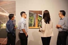 Further Reading: Visitors looking at photograph of viaduct