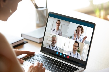 Female nurse have webcam conference with doctors colleagues