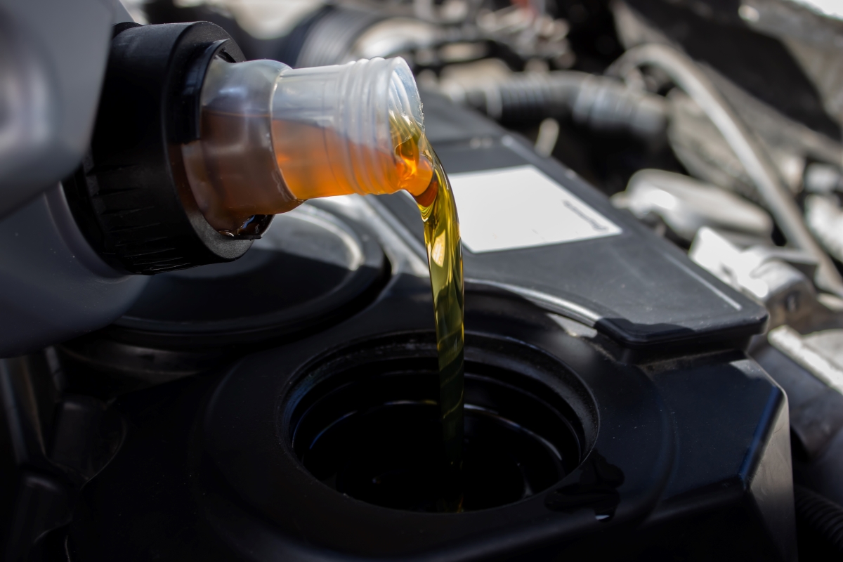 refueling-and-pouring-oil-quality-into-the-engine-2026-03-24-06-28-59-utc