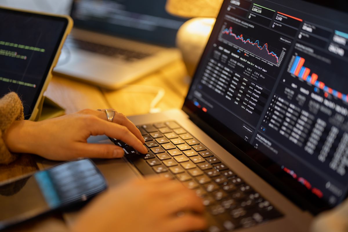 Woman working on some programming dashboard on laptop