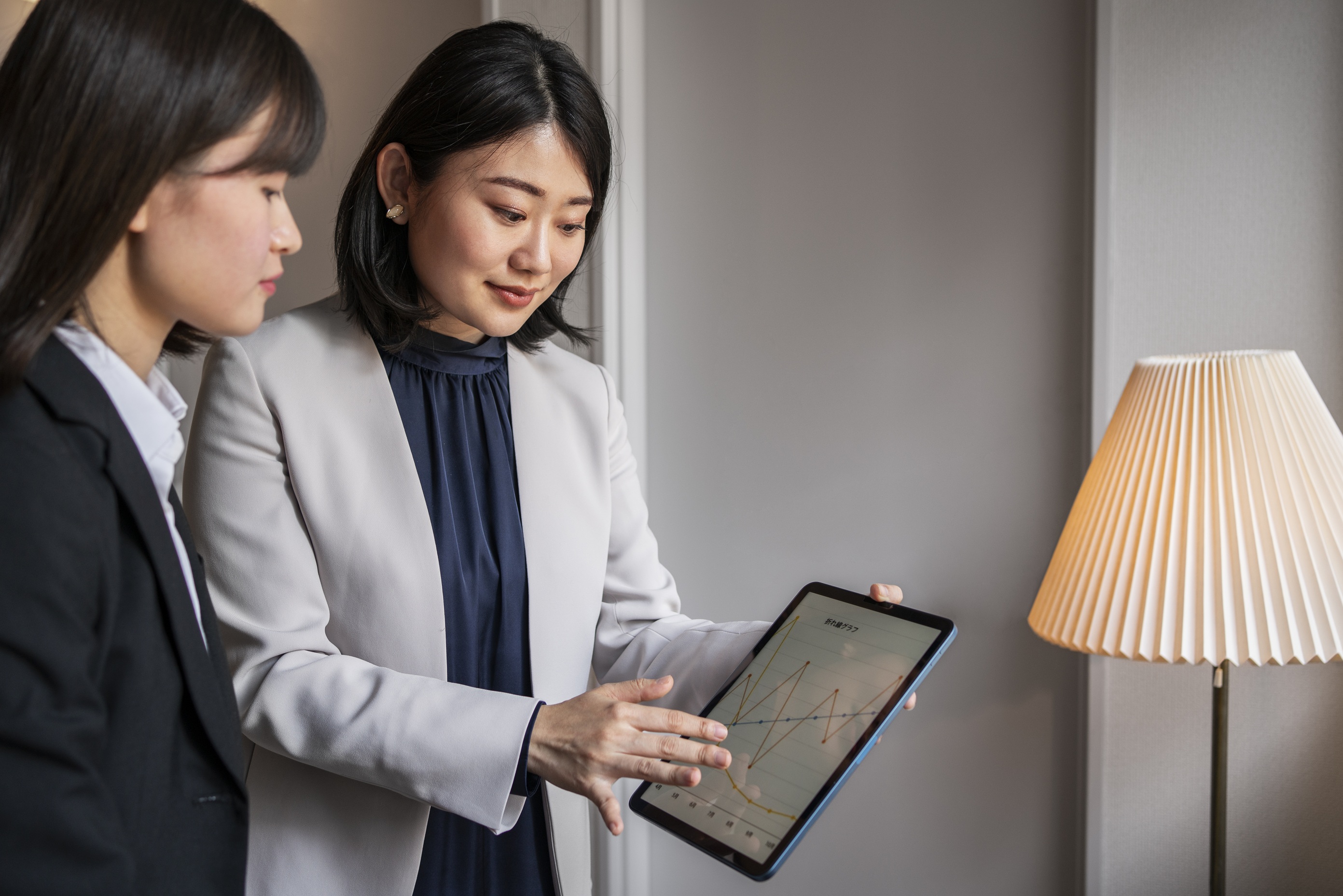 medium-shot-business-people-working-with-ipad