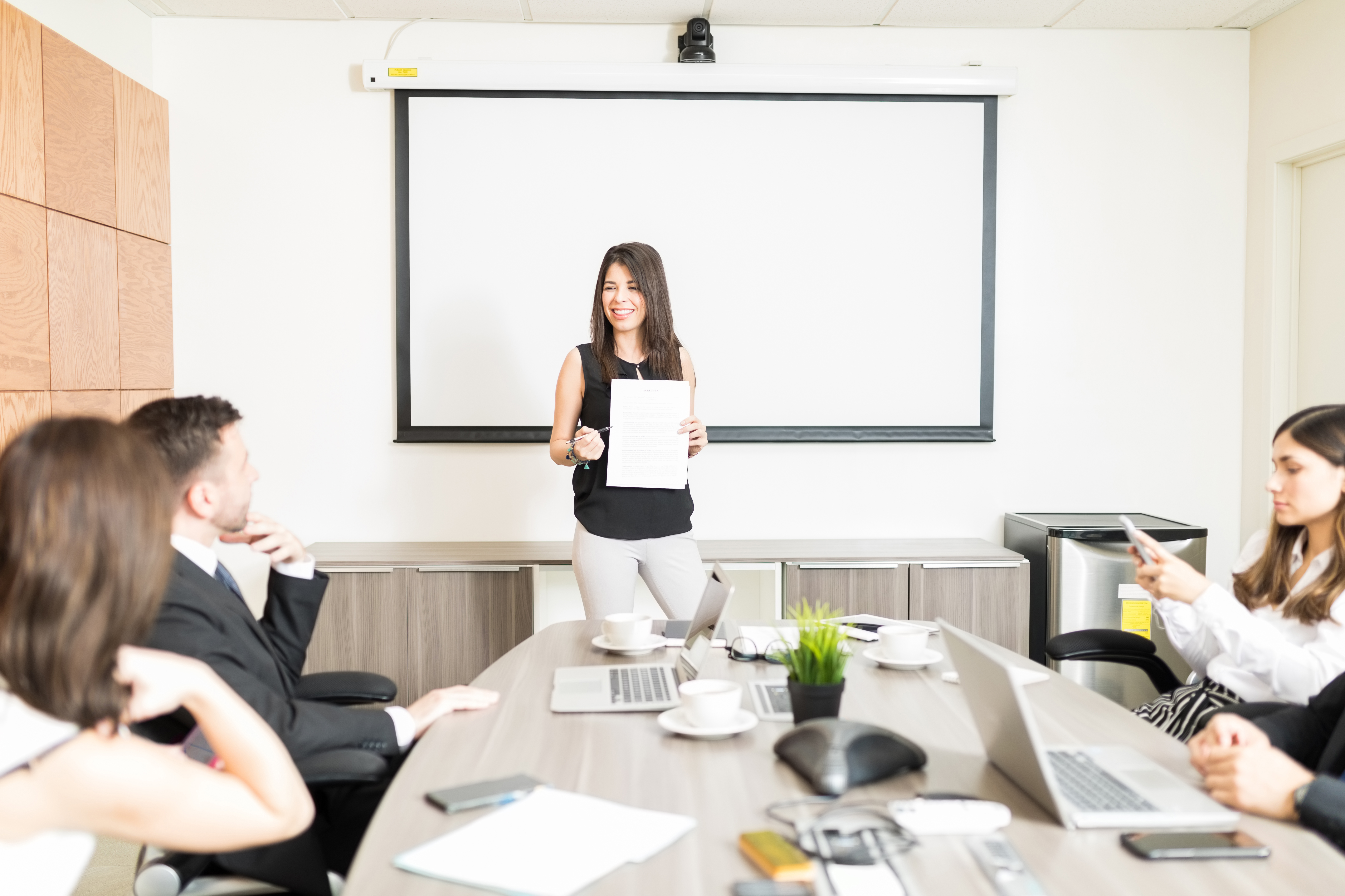 successful-female-boss-showing-market-analysis-coordinators-boardroom