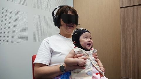 Woman holding a baby on her lap