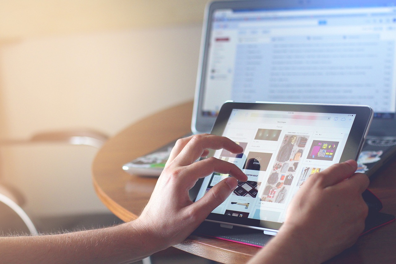 Person using a tablet to look at images