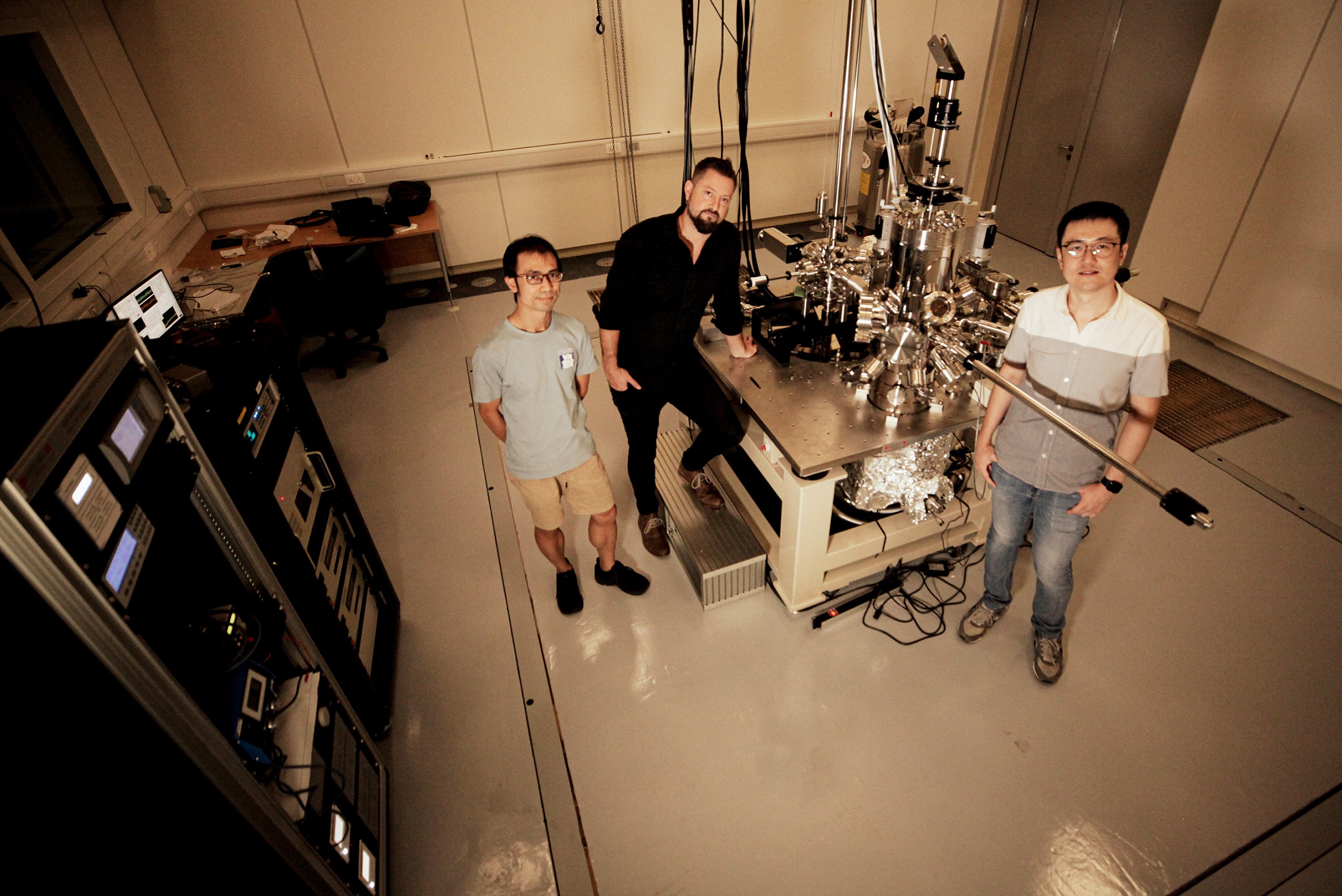 Dr Que Yande, a senior research fellow from Nanyang Technological University; Asst Prof Bent Weber who led the research; and PhD student Jia Junxiang, the first author of the study, with a scanning tunnelling microscope at the university.