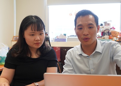 Asst Prof Yan Ran (L) and Research Fellow Dr Gong Huatian discussing the LACE model they developed. Credit: NTU Singapore