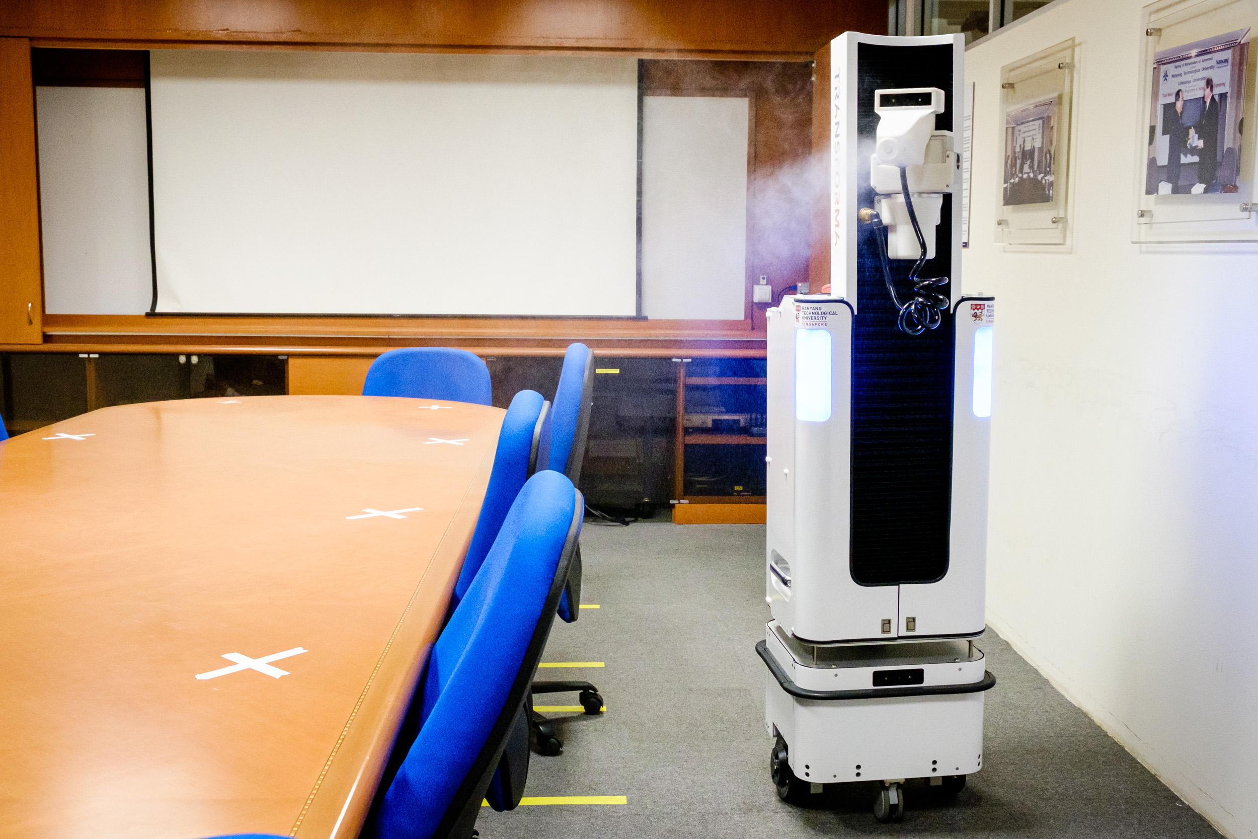 XDBOT disinfecting a table 