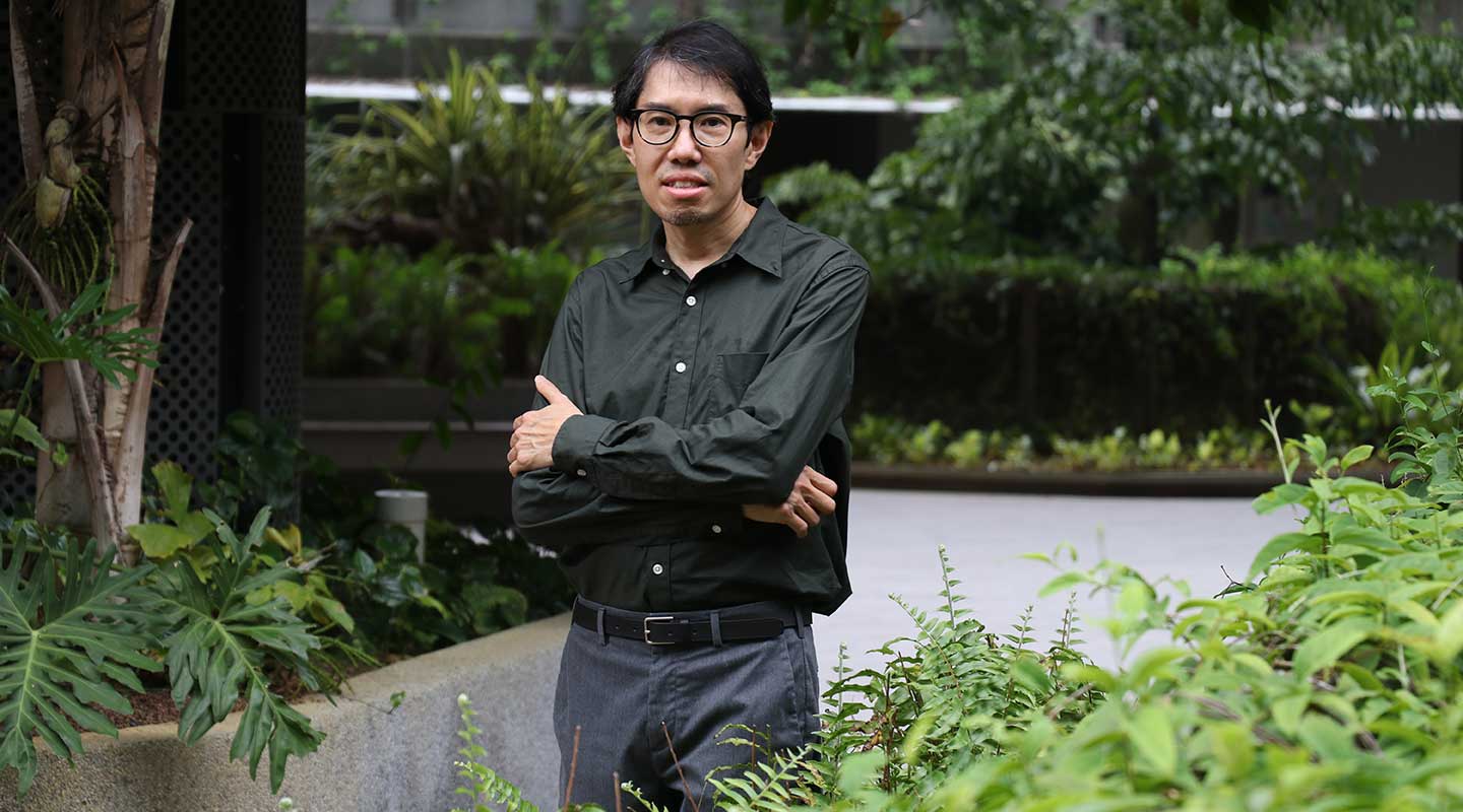 3/4 body photo of a male postgraduate.