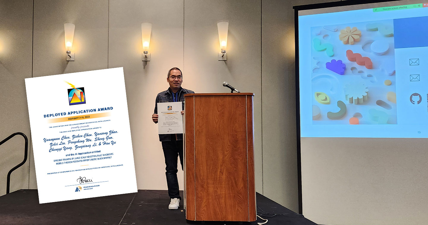 Photo of a postgraduate holding an award certificate on stage.