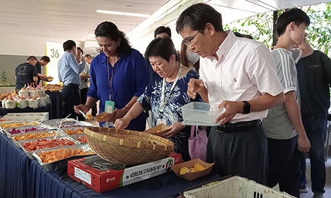 Photo of a spread of fruits and staff.