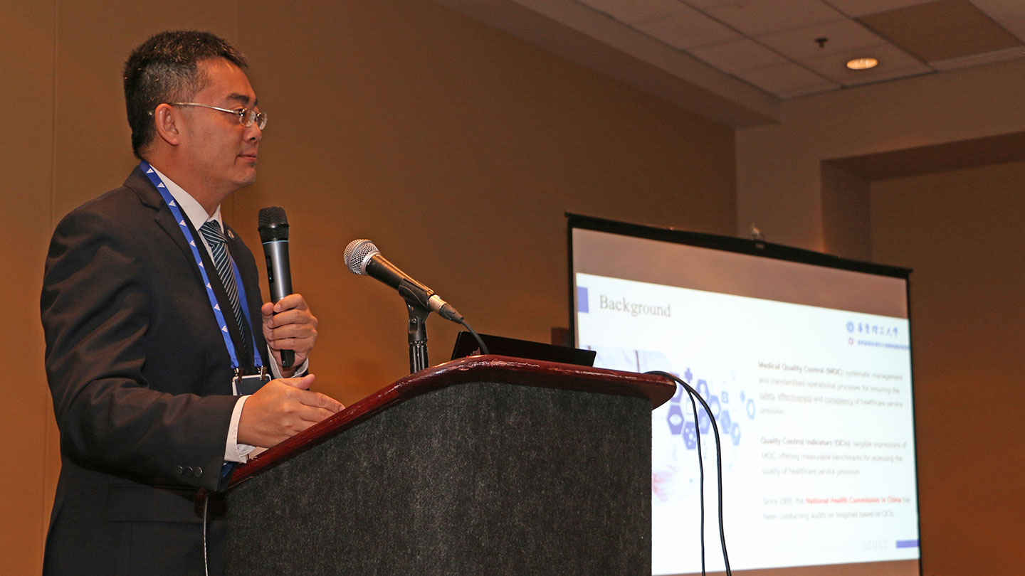 Photo of A/P Yu Han giving a talk