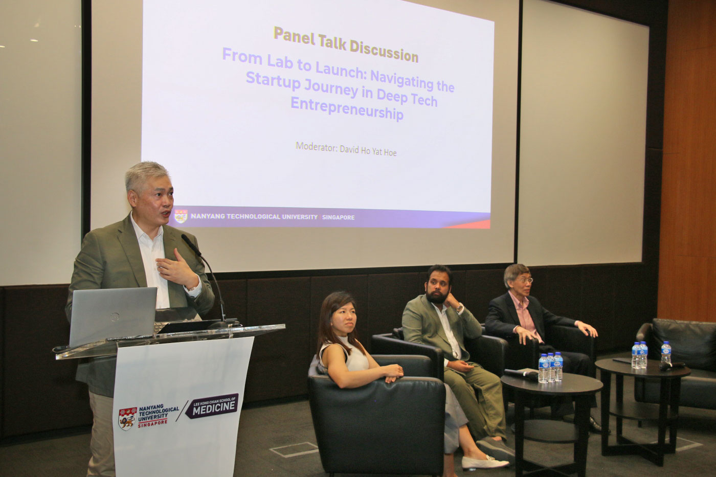 Photo of a moderator introduce the panelists during the launch of Alumni Dialogue.