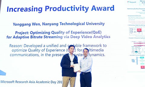 Dr Gao Guanyu received the award on behalf of Prof Wen Yonggang and team on stage during MSRA Academic Day 2019.