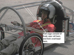 Driver in Nanyang Venture I cockpit with roll cage protection