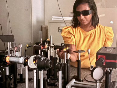 Dr Maria in the lab working on the system