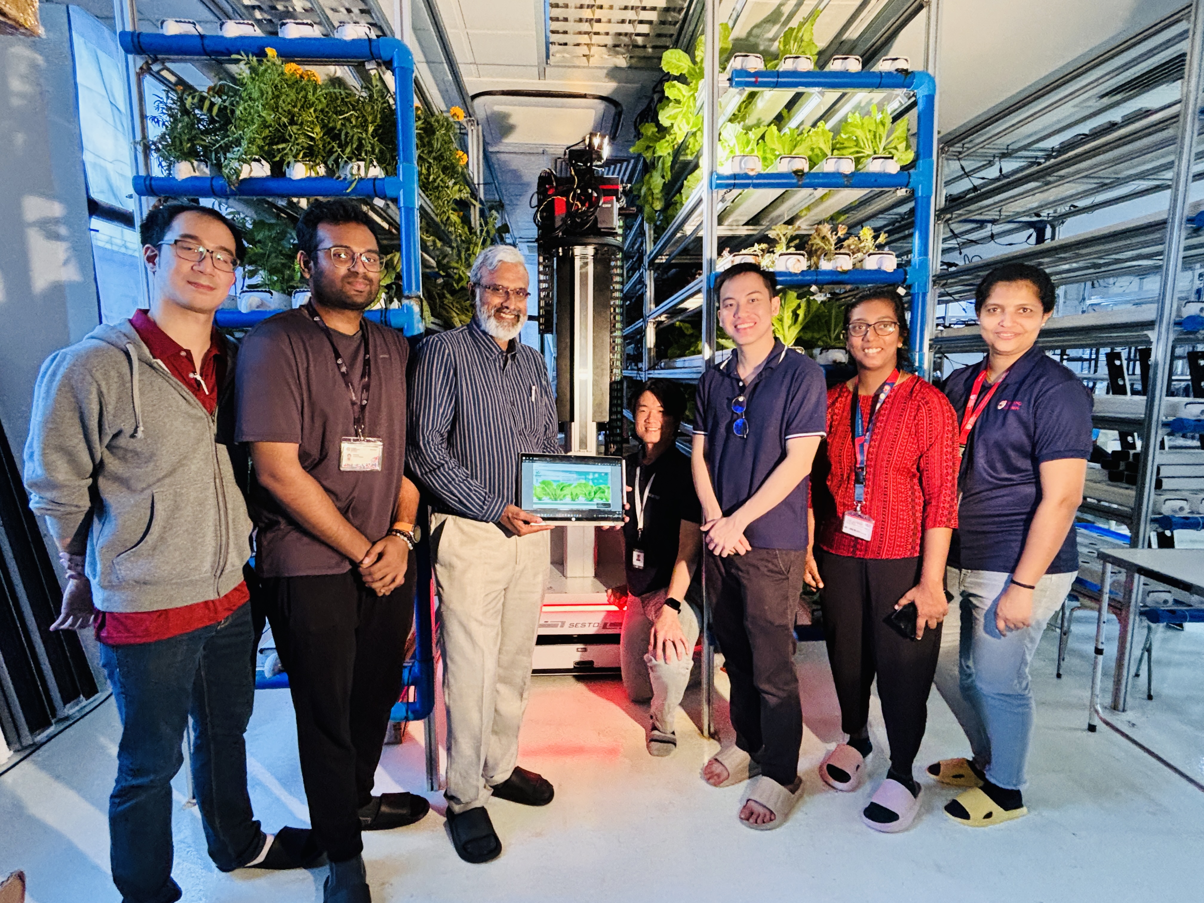 Dr Maria (second from right) and her team doing field trial with Urban Green Dot, a hydroponics company