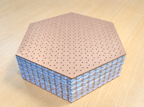 Photonic axion insulator made in Professor Zhang’s lab. Light propagates in a zig-zag network pattern when travelling across this exotic topological photonic crystal.