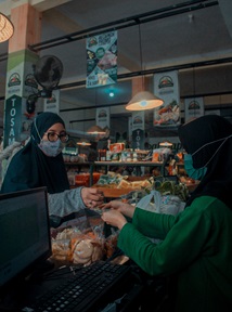 shopkeeper and customer in Banjar City, West Java, Indonesia