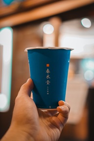 person holding a cup of bubble tea