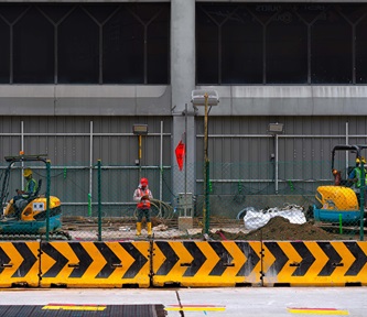 migrant worker doing construction work in Singapore