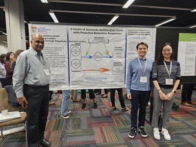CRADLE researchers presents their poster about their latest research