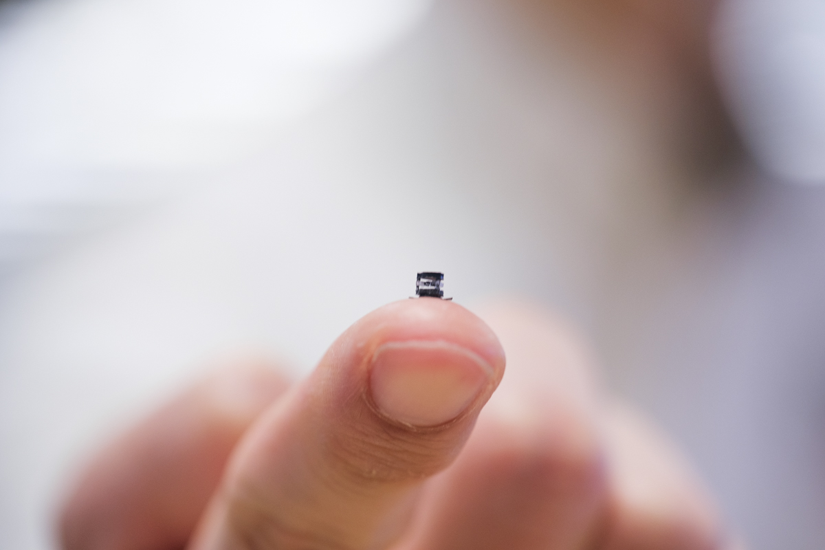 Robot surgeon prototype as small as a mosquito sits on a finger