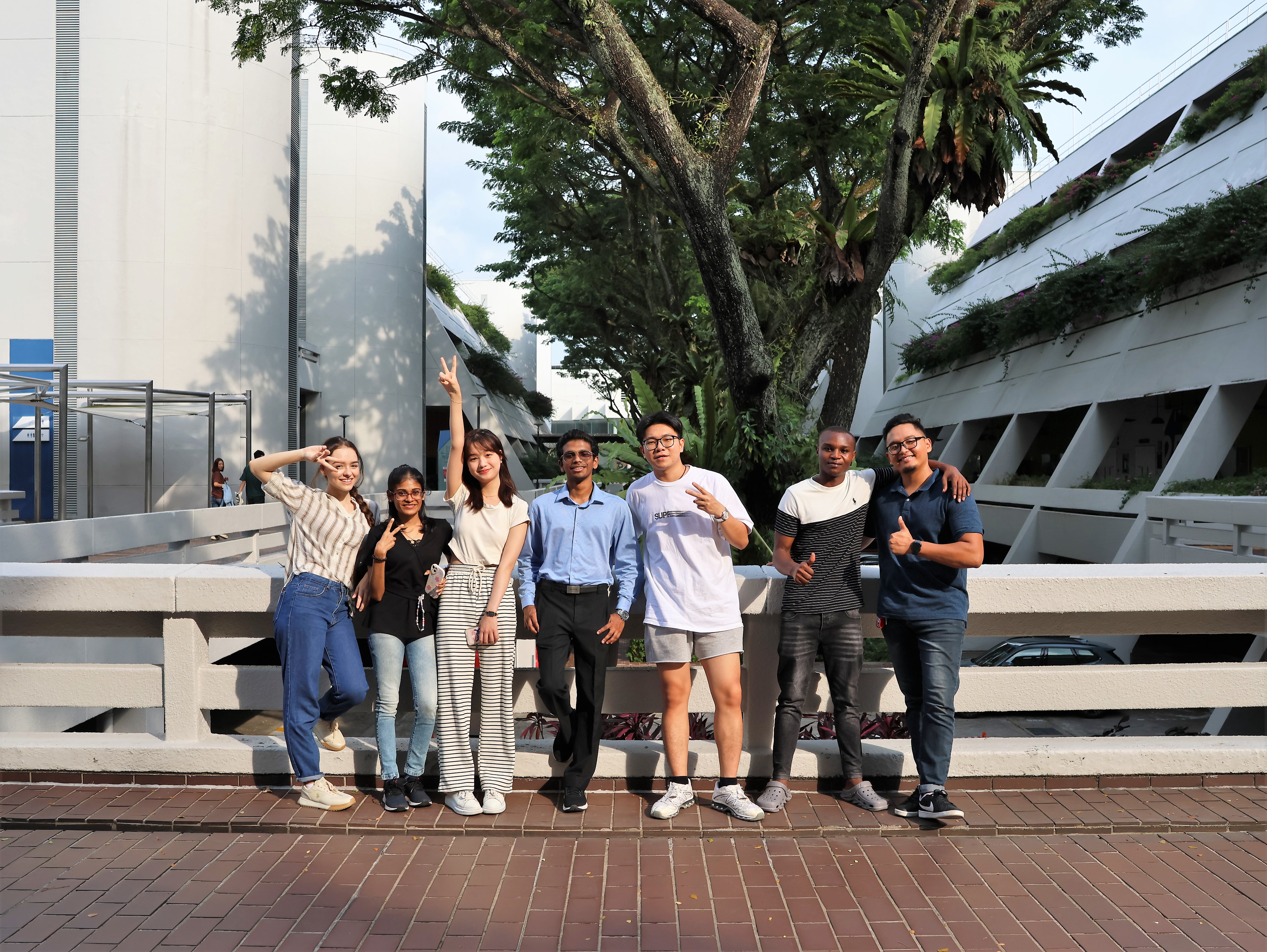 Diverse students smiling and facing the camera