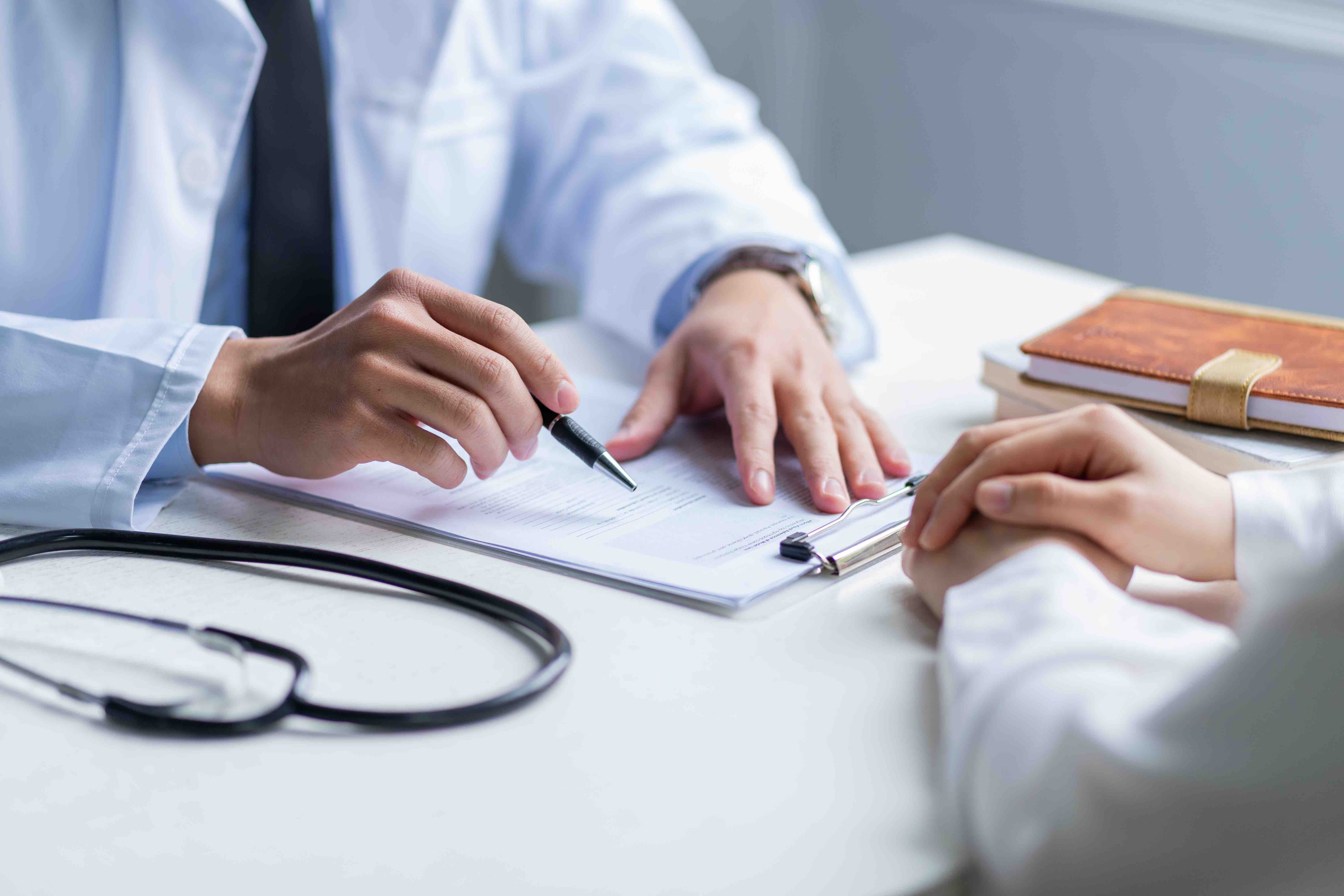 asian-male-doctor-examining-patient-clinic