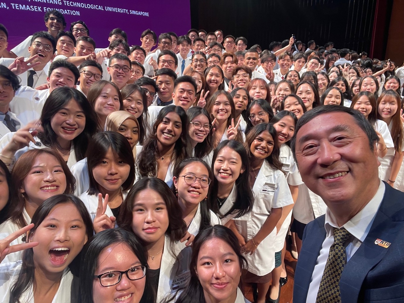 Dean with White Coat 2026 students
