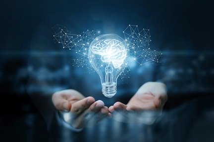 lightbulb with tech elements floating above hands