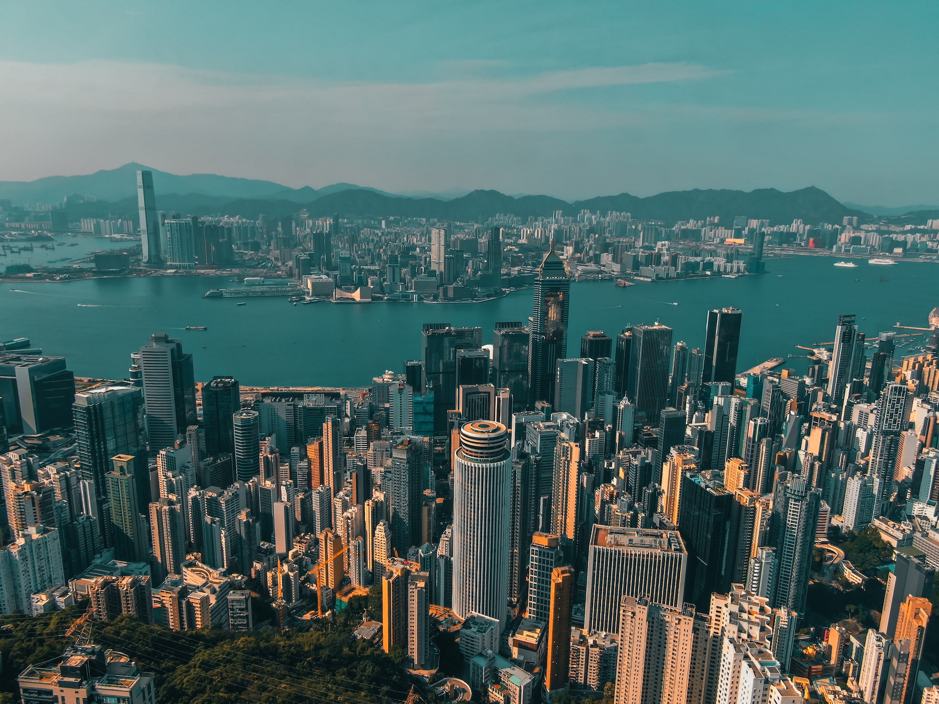 Futuristic cityscape of Hong Kong with skyscrapers and river