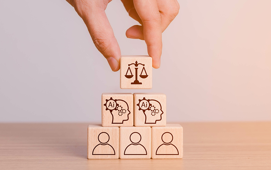 Cube-shaped wooden blocks with AI and law icons