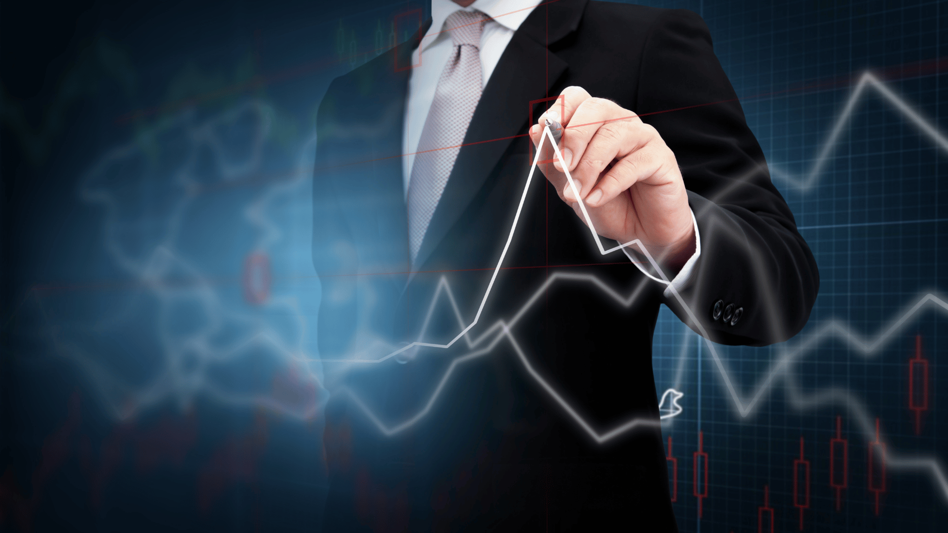 Investor drawing growth chart of profits