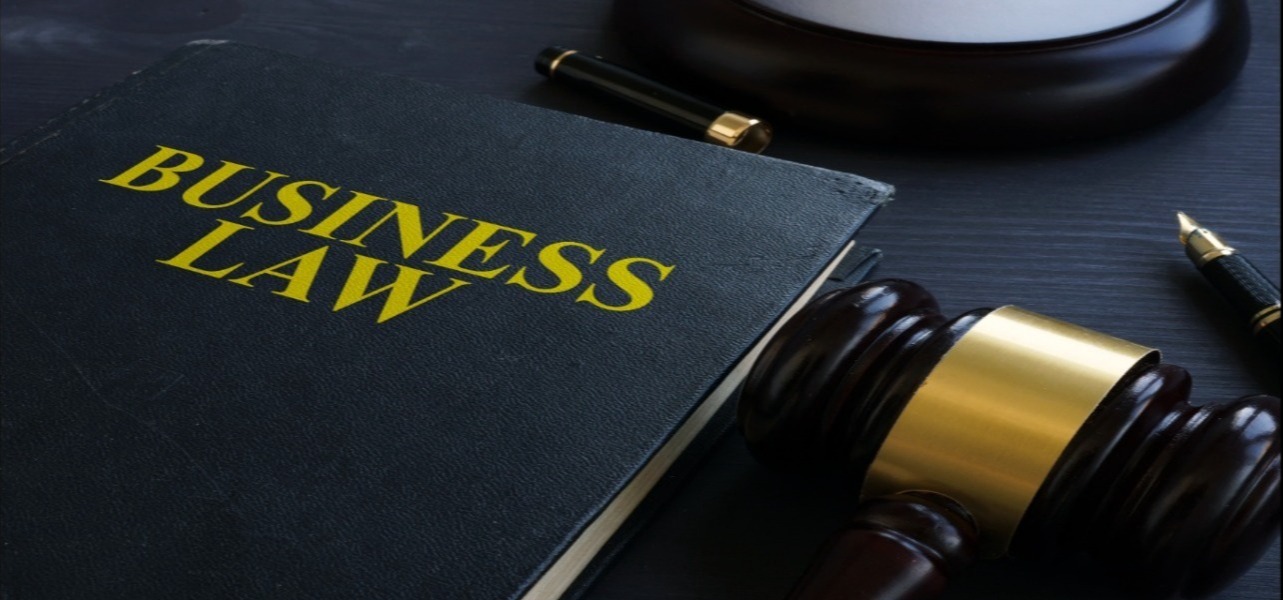 Business law book and gavel