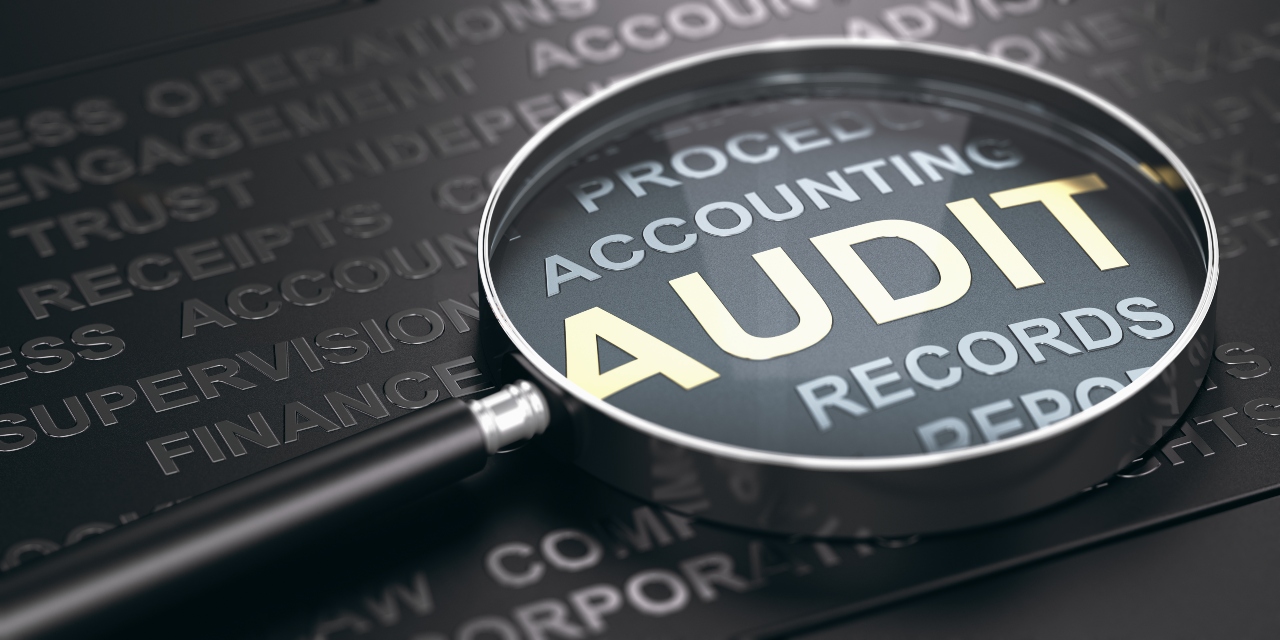 Magnifying glass over Audit words