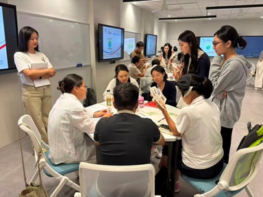 Interns at work: explaining the Getting-to-Zero (GTZ) game to workshop participants