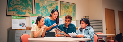 A Volcano Model Discussed by Science Teacher and Group of 4 Young Adult Students