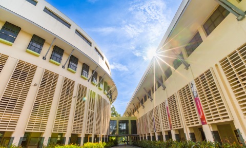 NIE outdoor with 2 buildings and the sun