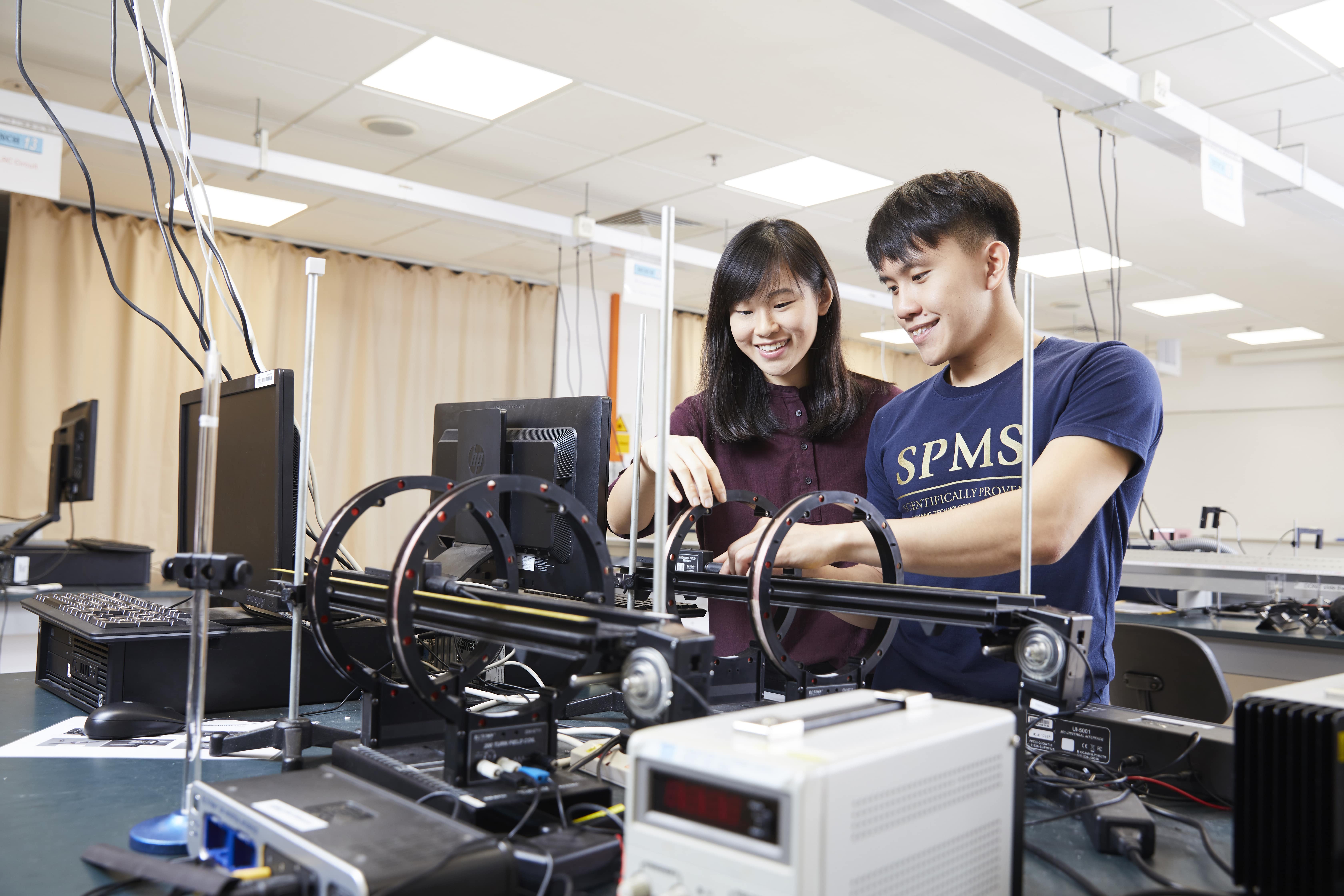 Two students in a SPMS lab